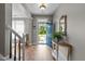 Inviting foyer with hardwood floors, a console table, and views of the open living spaces at 648 Long Melford Dr, Rolesville, NC 27571