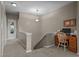 Hallway nook with wood desk, chair, and computer station near the staircase at 648 Long Melford Dr, Rolesville, NC 27571