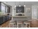 Stylish kitchen with stainless steel appliances, an island with seating, and gray cabinetry at 648 Long Melford Dr, Rolesville, NC 27571