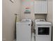 Well-equipped laundry room with modern washer, dryer, and storage at 648 Long Melford Dr, Rolesville, NC 27571