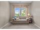 Cozy living room showcasing a comfortable sofa near a bright window at 648 Long Melford Dr, Rolesville, NC 27571