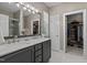 Beautiful main bathroom featuring double sinks, marble countertops, and walk-in closets at 648 Long Melford Dr, Rolesville, NC 27571