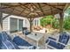 Spacious covered patio with comfortable seating, overlooking the backyard, for ultimate outdoor relaxation and entertaining at 648 Long Melford Dr, Rolesville, NC 27571