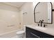 Bathroom featuring modern fixtures and a tub/shower combo at 71 E Boxley Dr, Wendell, NC 27591