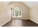 Vaulted bedroom featuring a large window and wood floors at 71 E Boxley Dr, Wendell, NC 27591