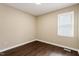 Cozy bedroom with hardwood floors, neutral paint, and ample natural light from the window at 71 E Boxley Dr, Wendell, NC 27591