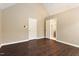 Neutral bedroom with wood flooring and a view to an attached bathroom at 71 E Boxley Dr, Wendell, NC 27591