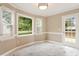 Dining area featuring large windows, neutral walls, and marble-look tile flooring at 71 E Boxley Dr, Wendell, NC 27591