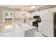 Inviting kitchen boasts white cabinets, sleek countertops, and modern stainless appliances at 71 E Boxley Dr, Wendell, NC 27591