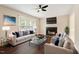 Bright living room with fireplace, ceiling fan, and comfortable seating at 71 E Boxley Dr, Wendell, NC 27591