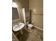 This bathroom features a pedestal sink, a toilet, and storage cabinets at 710 N Person St # 103, Raleigh, NC 27604