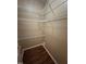 Walk-in closet features shelving for storage and organization at 710 N Person St # 103, Raleigh, NC 27604