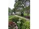 Well-maintained lawn and walking path with mature trees and landscaping in a peaceful neighborhood at 710 N Person St # 103, Raleigh, NC 27604