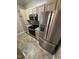 Modern kitchen featuring stainless steel appliances, wooden cabinets, and granite countertops at 710 N Person St # 103, Raleigh, NC 27604