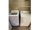 The laundry room includes a washer and dryer set with white appliances at 710 N Person St # 103, Raleigh, NC 27604