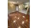 Open concept living room with hardwood floors, neutral paint, chandelier, and an open kitchen at 710 N Person St # 103, Raleigh, NC 27604