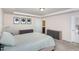 Calm bedroom with a tray ceiling and gray storage cubes at 728 Silo Park Dr, Wake Forest, NC 27587