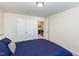 Cozy bedroom featuring double closets, neutral walls, and access to the upper level at 728 Silo Park Dr, Wake Forest, NC 27587