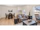 Cozy living and dining areas with wood floors, neutral paint, and plenty of natural light at 728 Silo Park Dr, Wake Forest, NC 27587