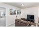 Cozy loft area with a comfortable leather chair and entertainment center at 728 Silo Park Dr, Wake Forest, NC 27587