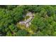 A luxurious property nestled among the trees, with a tennis court visible at 812 Kenmore Rd, Chapel Hill, NC 27514