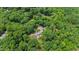 A bird's eye view shows how the house is surrounded by a large tree canopy at 812 Kenmore Rd, Chapel Hill, NC 27514