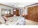 Relaxing bedroom features wood trim, light colored walls and a four poster bed at 812 Kenmore Rd, Chapel Hill, NC 27514