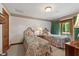 Cozy bedroom featuring twin beds, pastel decor, and balcony access at 812 Kenmore Rd, Chapel Hill, NC 27514