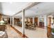 Large dining room with a long wooden table, multiple chairs, view to staircase and adjacent rooms at 812 Kenmore Rd, Chapel Hill, NC 27514