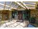 Covered entryway features stone accents, a decorative door, and outdoor seating at 812 Kenmore Rd, Chapel Hill, NC 27514