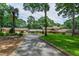 Picturesque home with stone accents, lush landscaping, and a long driveway at 812 Kenmore Rd, Chapel Hill, NC 27514