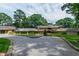 Expansive home with lush landscaping, circular driveway, and a serene setting at 812 Kenmore Rd, Chapel Hill, NC 27514