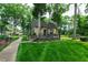 Charming cottage surrounded by mature trees and a beautifully landscaped yard at 812 Kenmore Rd, Chapel Hill, NC 27514