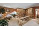 Unique foyer with a stone accent wall, glass staircase railings, and bright natural lighting at 812 Kenmore Rd, Chapel Hill, NC 27514