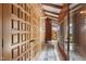 Inviting hallway showcasing wood paneling, tile flooring, and unique architectural details at 812 Kenmore Rd, Chapel Hill, NC 27514