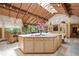 Bright kitchen featuring skylights, center island with cooking space, and wooden cabinets with ample storage at 812 Kenmore Rd, Chapel Hill, NC 27514