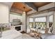 Charming kitchen featuring wood beams, white cabinets, and a cozy breakfast nook with picturesque window views at 812 Kenmore Rd, Chapel Hill, NC 27514