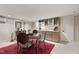 Cozy kitchenette with dining area, modern appliances, and ample cabinet space at 812 Kenmore Rd, Chapel Hill, NC 27514