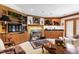 Elegant living room with custom wood built-ins, fireplace, and wet bar at 812 Kenmore Rd, Chapel Hill, NC 27514