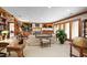 Spacious living room with a fireplace, built-in shelving, and lovely shuttered windows at 812 Kenmore Rd, Chapel Hill, NC 27514