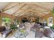 Spacious living room featuring vaulted ceilings, stone fireplace, and elegant furnishings at 812 Kenmore Rd, Chapel Hill, NC 27514