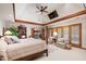 Beautifully appointed main bedroom with tray ceiling, ceiling fan, and neutral interior at 812 Kenmore Rd, Chapel Hill, NC 27514
