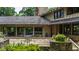 Charming stone patio with outdoor seating area surrounded by greenery at 812 Kenmore Rd, Chapel Hill, NC 27514