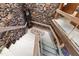Stone wall with staircase and wood banister leading to upper level at 812 Kenmore Rd, Chapel Hill, NC 27514