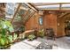 Bright sunroom with wood-paneled walls, skylights, a tiled floor, and views of the surrounding trees at 812 Kenmore Rd, Chapel Hill, NC 27514