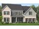 Charming two-story home with a beautifully landscaped yard and a welcoming front porch at 812 Timber Mist Ct, Cary, NC 27519