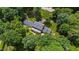 Aerial view of the expansive estate, showing a long driveway and surrounding mature trees at 820 Kenmore Rd, Chapel Hill, NC 27514