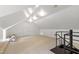Finished attic space perfect for extra storage or potential living area with carpeted floors and bright lighting at 820 Kenmore Rd, Chapel Hill, NC 27514