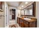 Bathroom with dual sinks, a large mirror, and a decorative rug at 820 Kenmore Rd, Chapel Hill, NC 27514