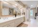 Bright bathroom with dual sinks, and a large mirror offering ample space for grooming and storage at 820 Kenmore Rd, Chapel Hill, NC 27514